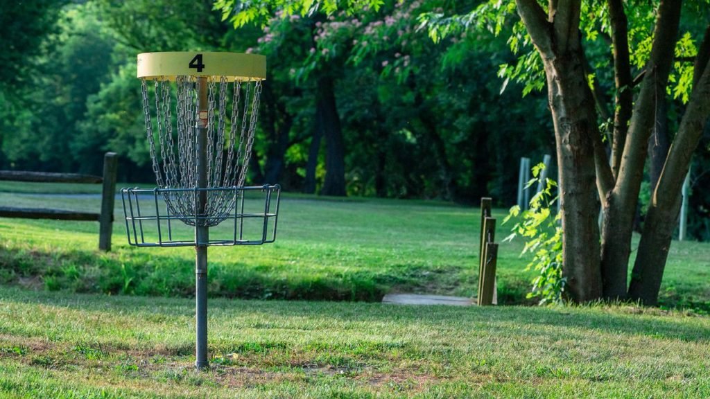 Disc golf basket in a park