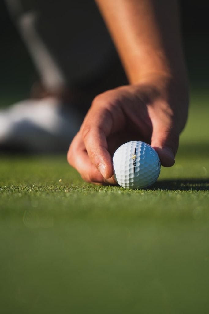 white golf ball on putting green