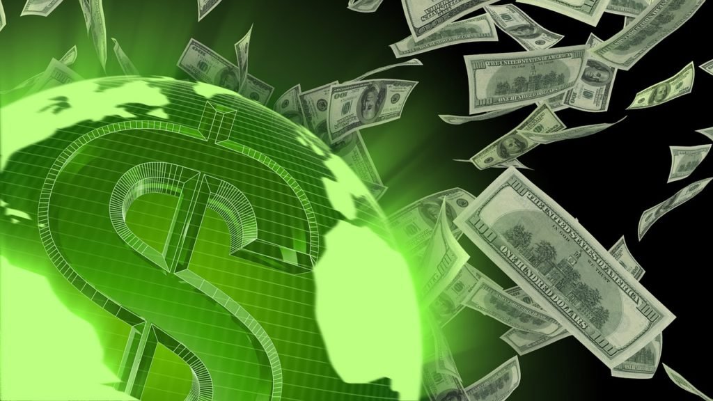 money fluttering around green glowing globe