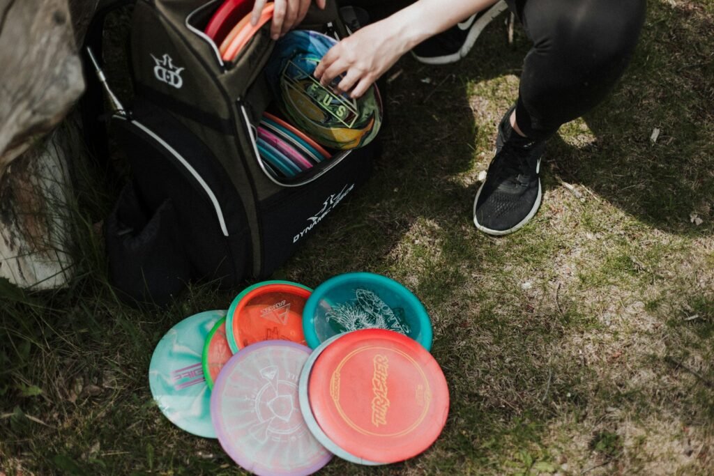 Person getting discs out of Dynamic Discs Trooper Bag