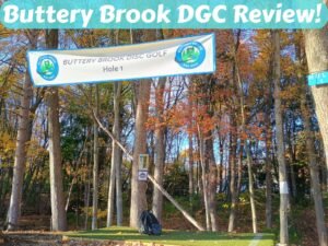 disc golf bag on tee pad under sign for buttery brook disc golf course